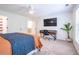 This bedroom is carpeted and has a desk and a wall-mounted television at 5589 Forkwood Nw Dr, Acworth, GA 30101