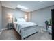 This basement bedroom has neutral paint, carpet, and decor lamps on a small nightstand at 5589 Forkwood Nw Dr, Acworth, GA 30101