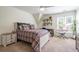 Comfortable bedroom featuring natural light, and neutral carpet at 5589 Forkwood Nw Dr, Acworth, GA 30101