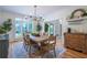 Formal dining room with large windows, hardwood floors, and decorative lighting at 5589 Forkwood Nw Dr, Acworth, GA 30101