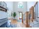 Bright foyer with hardwood floors, a high ceiling, decorative staircase, and a stunning front door at 5589 Forkwood Nw Dr, Acworth, GA 30101