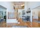 Elegant foyer features hardwood floors, a staircase with iron railings, and views to the living spaces at 5589 Forkwood Nw Dr, Acworth, GA 30101