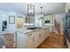 Elegant kitchen features a large island with marble countertops and pendant lighting at 5589 Forkwood Nw Dr, Acworth, GA 30101