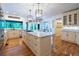 Open concept kitchen features a large island, stainless appliances, and view of the backyard at 5589 Forkwood Nw Dr, Acworth, GA 30101