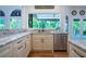 Kitchen showcasing granite countertops, stainless steel appliances, and a view to the backyard at 5589 Forkwood Nw Dr, Acworth, GA 30101