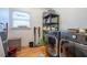 Efficient laundry room with washer, dryer, storage and window with blinds at 5589 Forkwood Nw Dr, Acworth, GA 30101