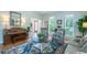 Cozy living room showcasing large windows, stylish furniture, and beautiful hardwood floors at 5589 Forkwood Nw Dr, Acworth, GA 30101