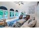 Bright living room offers high ceilings, French doors to the deck, comfortable seating, and elegant decor at 5589 Forkwood Nw Dr, Acworth, GA 30101