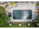 A pristine backyard pool with an attached spa is bordered by a stone patio and lush landscaping at 5589 Forkwood Nw Dr, Acworth, GA 30101