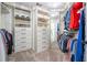 Walk-in closet with custom shelving and ample storage space for clothing at 5589 Forkwood Nw Dr, Acworth, GA 30101