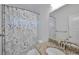 Bathroom features a granite countertop with a decorative shower curtain at 1443 Metropolitan Se Ave, Atlanta, GA 30316