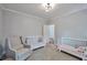 Comfortable Bedroom featuring two cribs and a comfortable chair at 1443 Metropolitan Se Ave, Atlanta, GA 30316