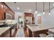 Well-equipped kitchen with stainless steel appliances and a stylish island with seating at 1443 Metropolitan Se Ave, Atlanta, GA 30316