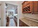Gourmet kitchen area with granite countertops, modern appliances, and wine storage at 1443 Metropolitan Se Ave, Atlanta, GA 30316