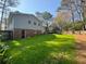 Expansive backyard featuring a well-maintained lawn, wood fencing, and a convenient rear entry at 3210 Ebenezer Rd, Marietta, GA 30066