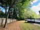 Large, fenced backyard with a spacious deck, perfect for pets or outdoor activities at 3210 Ebenezer Rd, Marietta, GA 30066