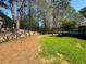 View of the large backyard with a wooden fence and spacious deck, perfect for outdoor entertaining at 3210 Ebenezer Rd, Marietta, GA 30066