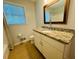 Bathroom featuring granite countertops and a window providing natural light at 3210 Ebenezer Rd, Marietta, GA 30066