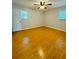 Bedroom with pristine hardwood floors, a ceiling fan, and natural light from window at 3210 Ebenezer Rd, Marietta, GA 30066