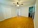 Bedroom boasts wood floors, fan, and closet, plus access to an ensuite bathroom at 3210 Ebenezer Rd, Marietta, GA 30066
