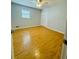 Bedroom with hardwood floors, double door closet, and a bright window at 3210 Ebenezer Rd, Marietta, GA 30066