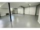 Expansive garage with epoxy floor, shelving, two doors, and ample space at 3210 Ebenezer Rd, Marietta, GA 30066