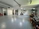 Spacious garage with epoxy flooring, utility sink, and easy yard access at 3210 Ebenezer Rd, Marietta, GA 30066