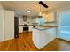 Well-lit kitchen featuring stainless steel appliances, white cabinets, granite counters, and modern pendant lighting at 3210 Ebenezer Rd, Marietta, GA 30066