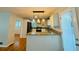 Bright kitchen with granite countertops, stainless steel appliances, and modern pendant lighting above the breakfast bar at 3210 Ebenezer Rd, Marietta, GA 30066