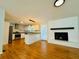 Open floor plan showcasing the modern kitchen and inviting living room with hardwood flooring at 3210 Ebenezer Rd, Marietta, GA 30066