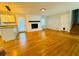 Living area with hardwood floors and inviting fireplace, offering a perfect space to gather at 3210 Ebenezer Rd, Marietta, GA 30066