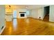 Bright and open living room featuring hardwood floors and a white brick fireplace at 3210 Ebenezer Rd, Marietta, GA 30066