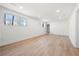 Spacious finished basement with hardwood floors, white walls, recessed lighting, and natural light from two windows at 380 Atwood Nw Dr, Marietta, GA 30064