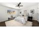 Inviting bedroom with a ceiling fan, plush rug, neutral tones, and ample natural light from two windows at 380 Atwood Nw Dr, Marietta, GA 30064