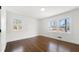 Bright bedroom with wood floors, two windows, and white trim at 380 Atwood Nw Dr, Marietta, GA 30064
