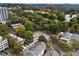 An aerial view shows surrounding community, trees and a lake at 242 12Th Ne St # 14, Atlanta, GA 30309