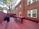 Inviting backyard deck with painted wood, table, and seating, perfect for outdoor entertaining with a privacy fence at 242 12Th Ne St # 14, Atlanta, GA 30309