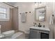Updated bathroom featuring modern fixtures, neutral tile, and a vanity with gray cabinets at 242 12Th Ne St # 14, Atlanta, GA 30309