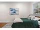 Bright bedroom with natural light, complemented by hardwood floors and minimalist decor at 242 12Th Ne St # 14, Atlanta, GA 30309