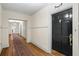 Hallway with wood floors and black entry door at 242 12Th Ne St # 14, Atlanta, GA 30309