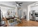 Bright living room with hardwood floors, comfortable seating, and modern appliances at 242 12Th Ne St # 14, Atlanta, GA 30309