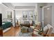 Inviting living space with a view into the bedroom, hardwood floors and comfortable seating at 242 12Th Ne St # 14, Atlanta, GA 30309