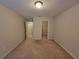 Bedroom with adjoining closet space and neutral carpeting at 8265 Village Pl, Suwanee, GA 30024