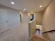 Upstairs hallway that leads to bedrooms and staircase at 8265 Village Pl, Suwanee, GA 30024