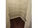 Pantry featuring white wire shelves and hardwood floors at 8265 Village Pl, Suwanee, GA 30024