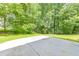 A concrete patio in the backyard provides a great space for outdoor seating and entertaining at 915 Chipley Ct, Marietta, GA 30062
