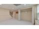 Finished basement with white floors and a closet at 915 Chipley Ct, Marietta, GA 30062