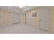 Finished basement with white-tiled floors and updated lighting at 915 Chipley Ct, Marietta, GA 30062