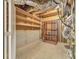 Unfinished basement with shelving and door to the utility area at 915 Chipley Ct, Marietta, GA 30062