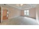 Bedroom with a ceiling fan and a view of a hallway with hardwood floors at 915 Chipley Ct, Marietta, GA 30062